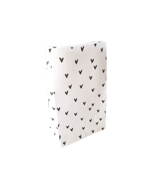witte blokzak met zwarte hartjes